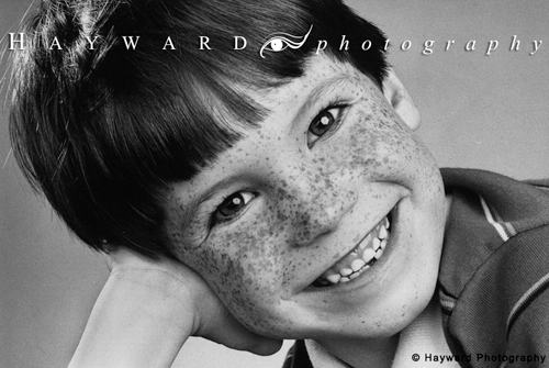 Freckled Boy\'s Smiling Head Shot