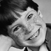 Freckled Boy\'s Smiling Head Shot