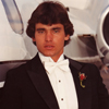 Male Model in Tuxedo next to a Lear Jet