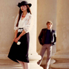 Male Model Watching Female Model Among Large Pillars