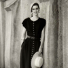Female Model Posing next to Stucco Wall