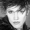 Head Shot of Female Model in Feathered Hair and Boa