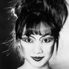 Head Shot of Female Model with Asian Make-up and WIld Hair