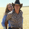 Female and Male Models Posing in Wheat Field