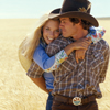 Female and Male Models Posing in Wheat Field