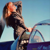 Female Model In Very Early Sunlight on a WWII P51 Mustang Fighter