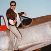 Male Model In Very Early Sunlight on a WWII P51 Mustang Fighter