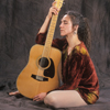 Maggie Simpson Posing with Her Guitar for a Promotional Shot