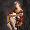 Maggie Simpson Singing with Her Guitar for a Promotional Shot